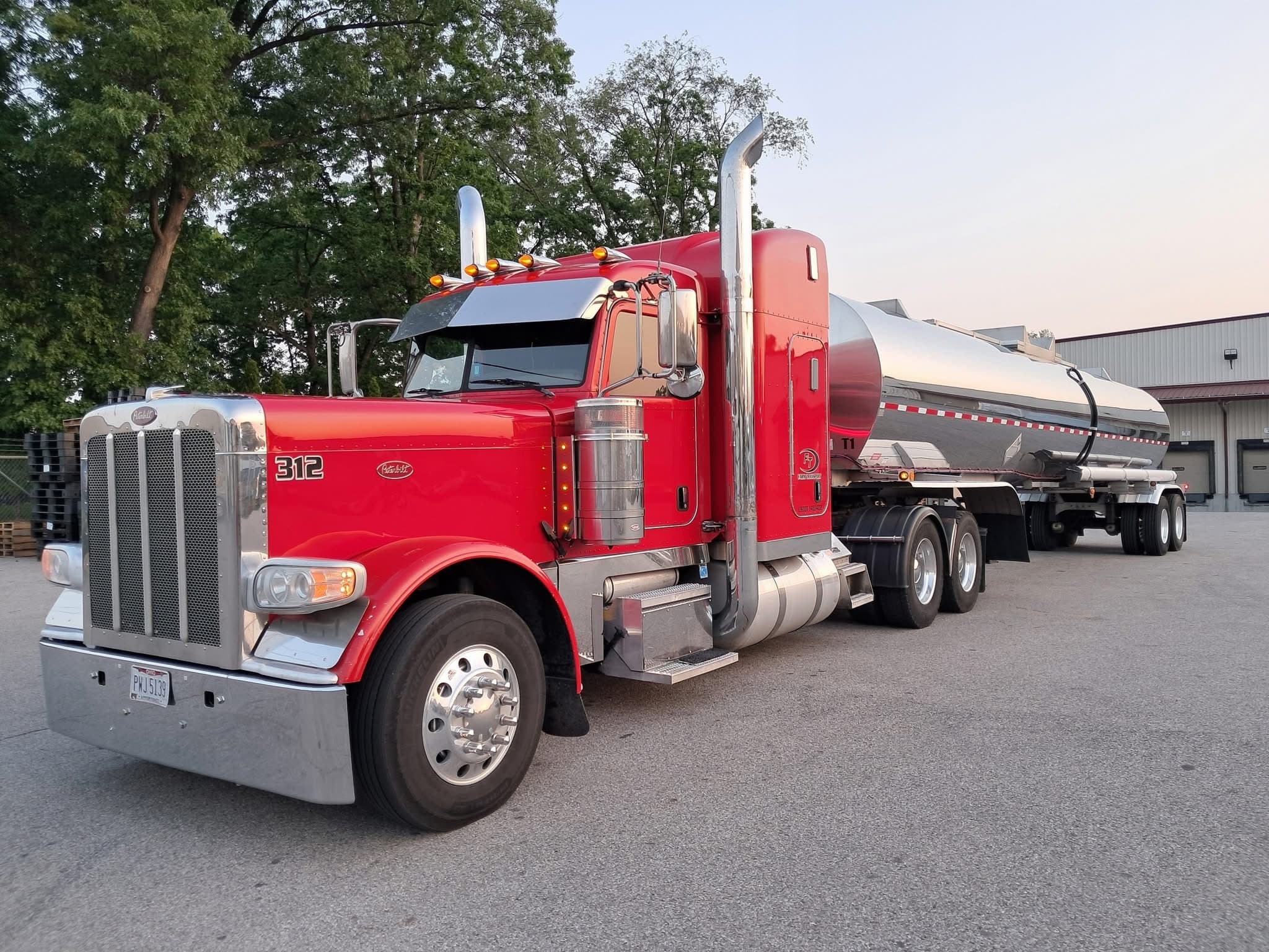 Unit 312 — the founder's red Peterbilt hooked to a tanker trailer